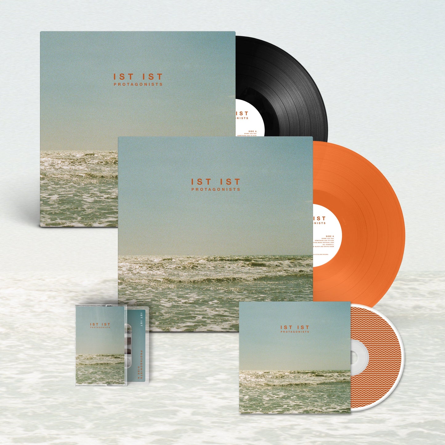 IST IST 'Protagonists’ LP - Bundle - Limited Edition Translucent Orange 12" Vinyl Disc + Black Heavyweight Vinyl 12" Disc + CD + Cassette